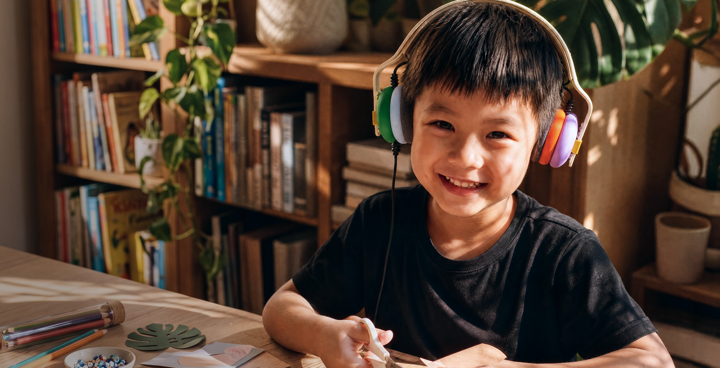 A kid wearing Kibu headphones