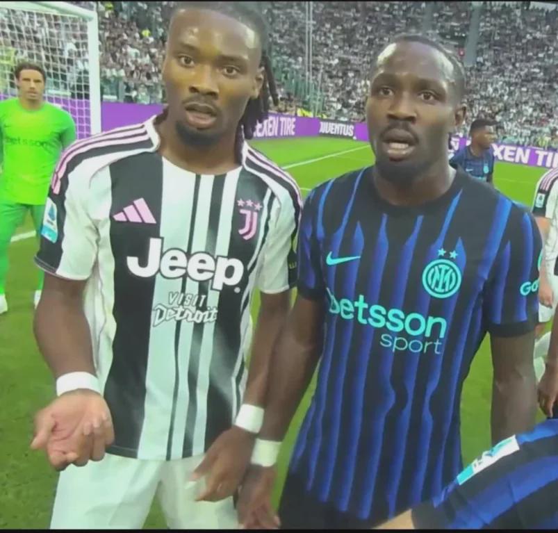 Footballer brothers for rival teams getting scolded by referee